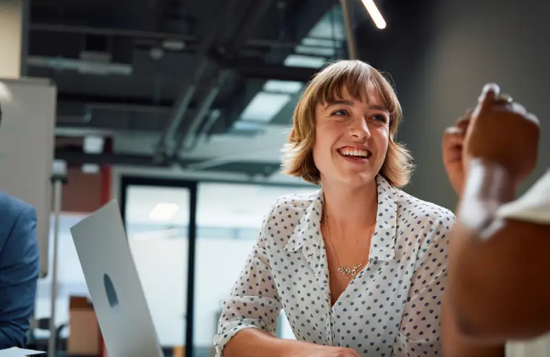 Lady smiling in a business meeting