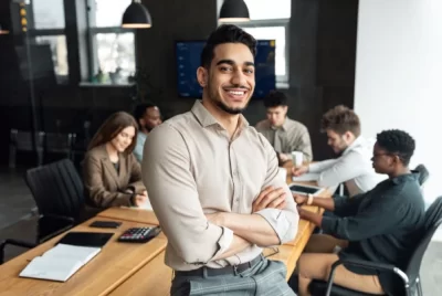 Man smiling at team meeting